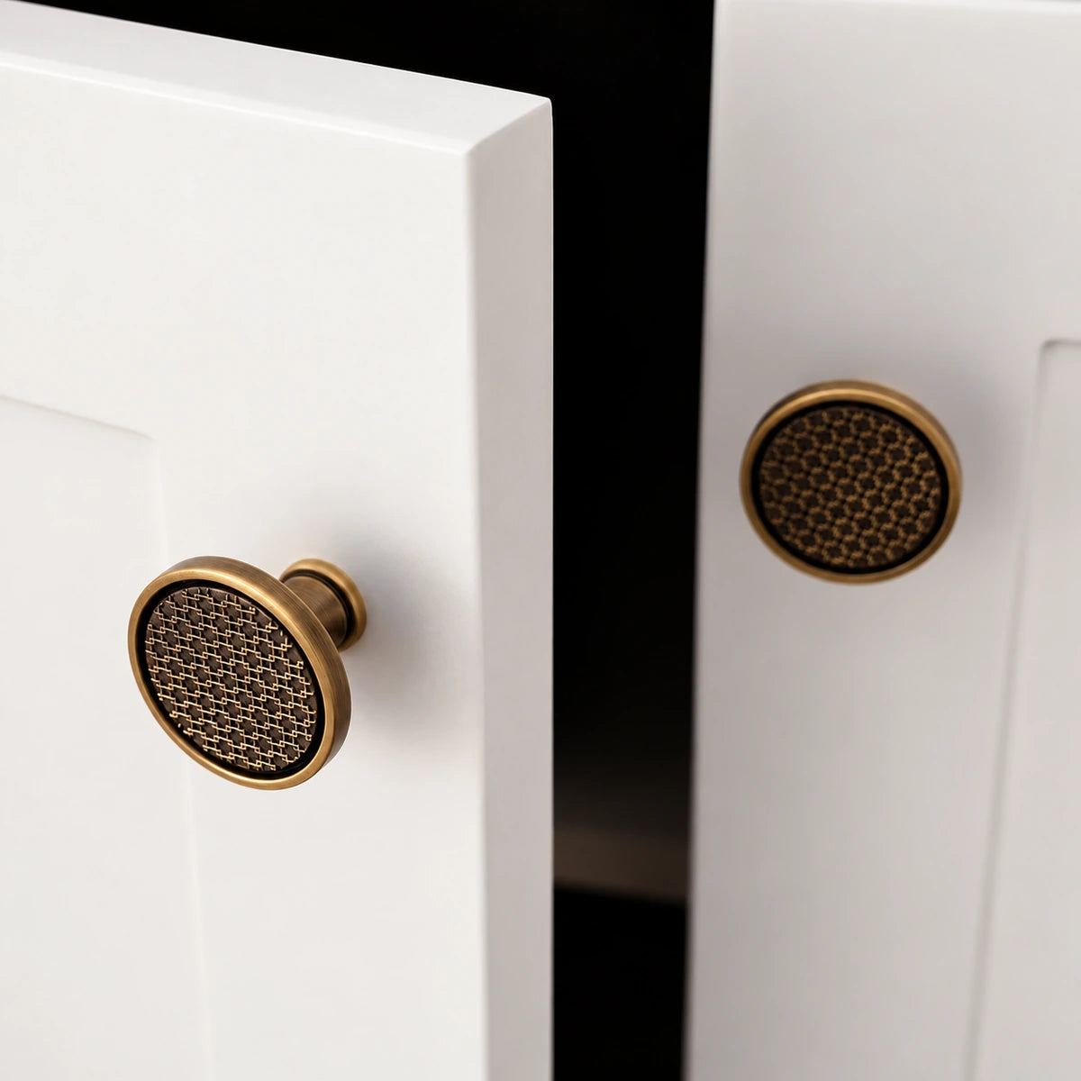 Round antique brass lattice cabinet knobs with dark recessed pattern