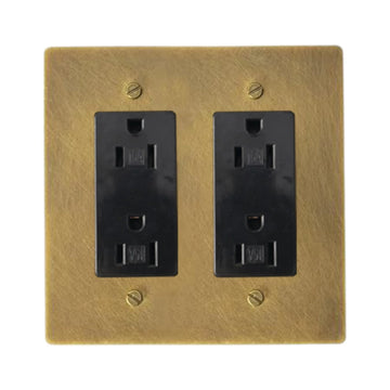 Two-gang unlacquered antique brass (hand-brushed) plate with two black regular 15A duplex outlets.