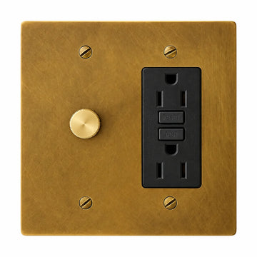 2-gang antique brass (hand-brushed) plate. One 250W single-pole brass rotary dimmer on the left and one black 15A GFCI outlet on the right.