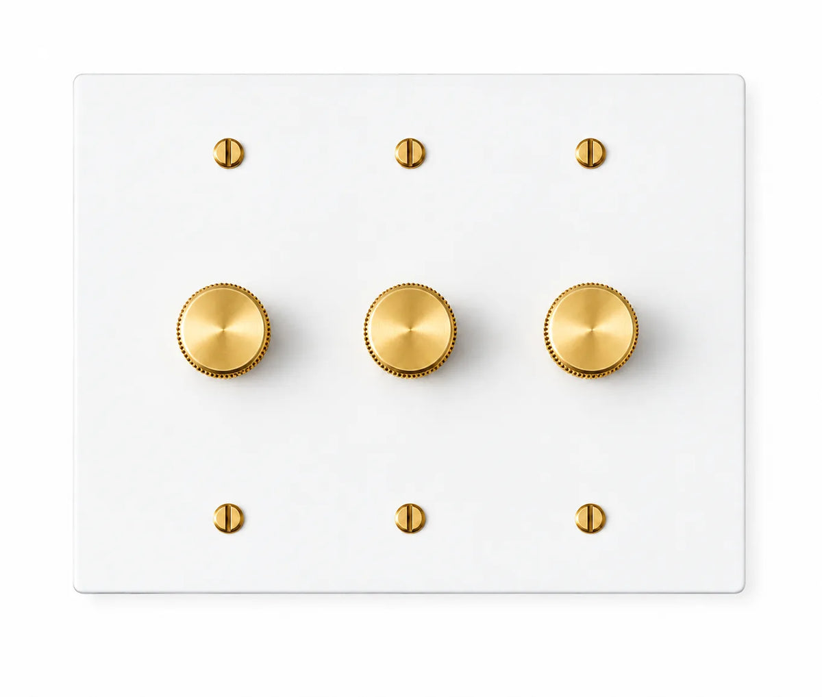 White three-gang plate with three brass rotary dimmer knobs and six brass screws