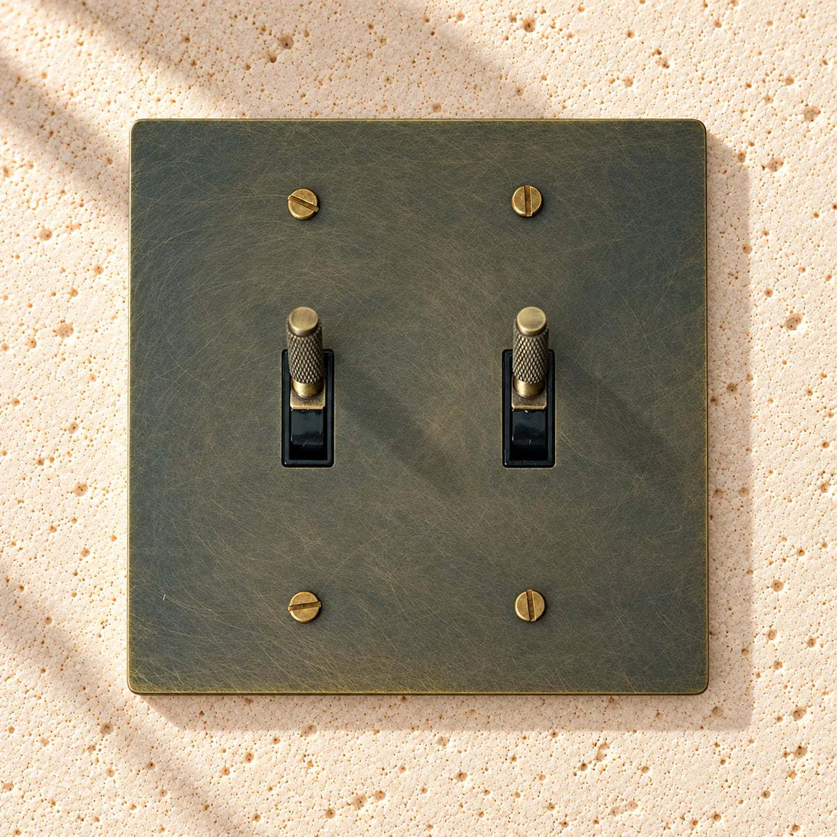 Bronze double toggle switch plate with textured surface