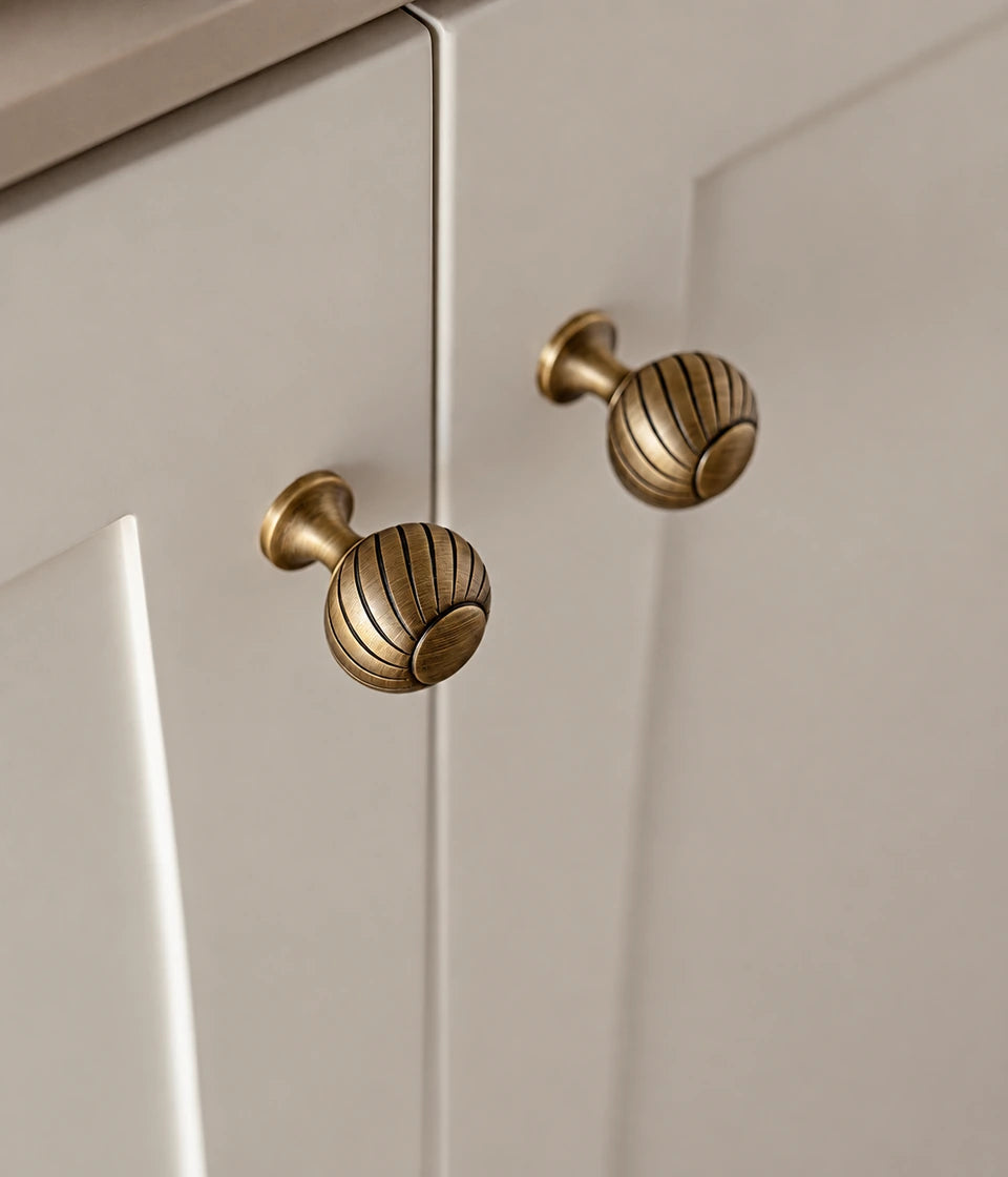 Swirl knobs with flat circular tops installed on cabinet doors