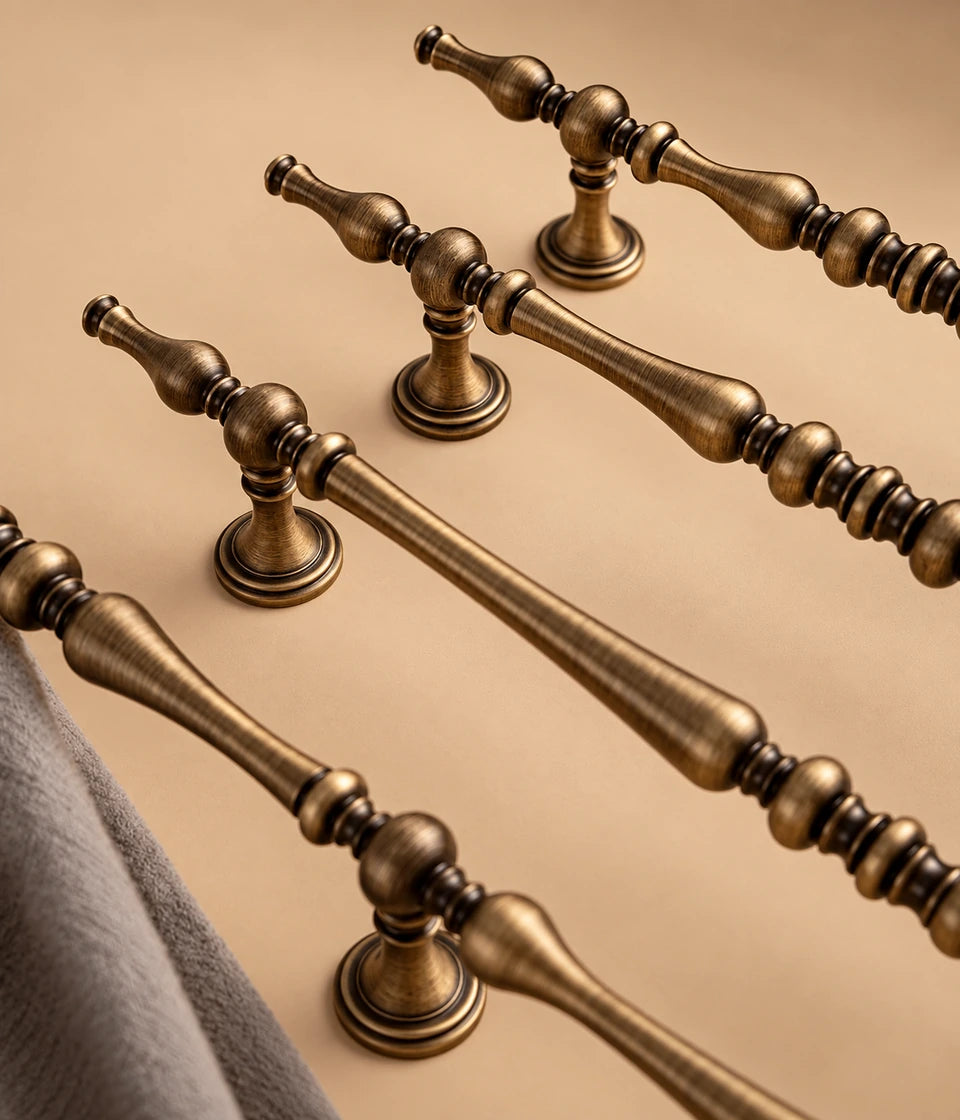 Turned spindle cabinet pulls showing flared round bases and ringed centers