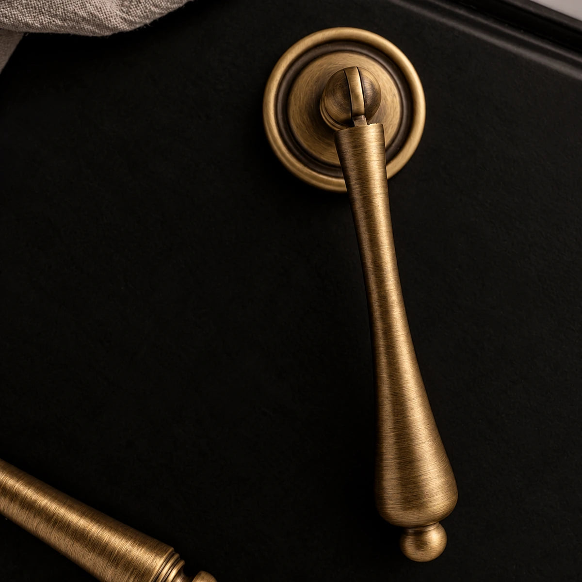 Tapered antique brass pendant with round backplate and ball tip
