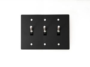 Contemporary 3-Gang Black Brass Plate with Silver Toggle - Sleek and functional triple-gang switch panel, ideal for modern interior settings