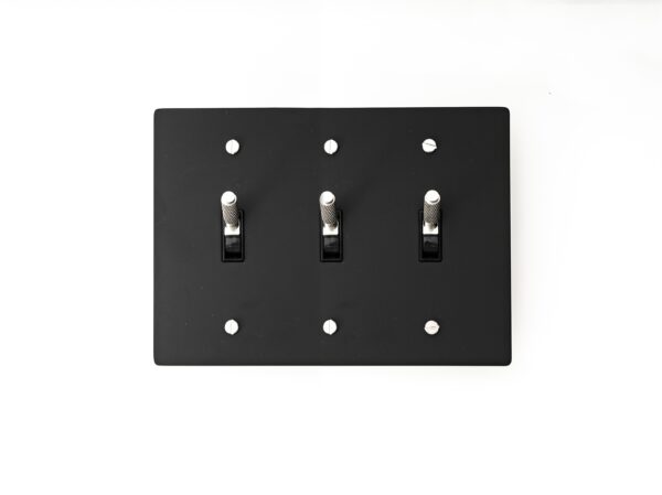 Contemporary 3-Gang Black Brass Plate with Silver Toggle - Sleek and functional triple-gang switch panel, ideal for modern interior settings