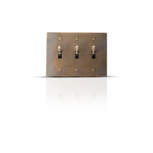 Antique finish brass toggle switch plate with three gangs for classic interior control.