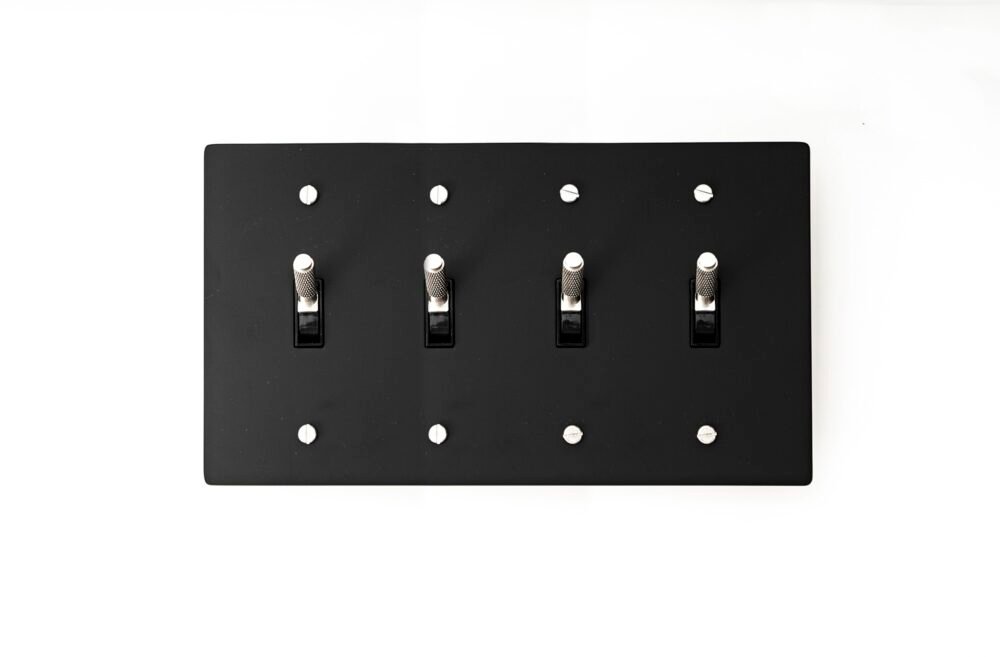 Versatile 4-Gang Black Brass Plate with Silver Toggle - Multi-gang switch panel, offering style and functionality for diverse modern interiors