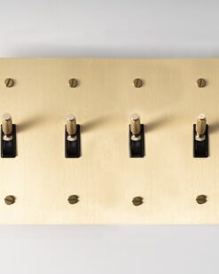 Four-Gang Satin Gold Brass Toggle Switch - Quadruple-toggle switch in a durable satin gold brass finish