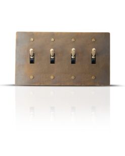 Antique finish brass toggle switch plate with four gangs for classic interior control.
