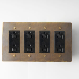 aged brass 4-gang duplex power outlet, a vintage-inspired, multi-functional electrical fixture for comprehensive power access in your space