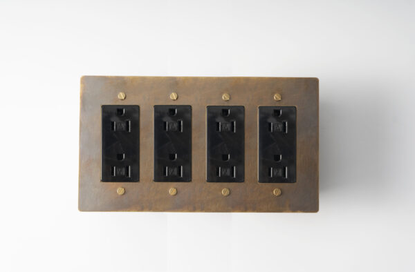 aged brass 4-gang duplex power outlet, a vintage-inspired, multi-functional electrical fixture for comprehensive power access in your space