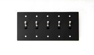 Versatile 4-Gang Black Brass Plate with Silver Toggle - Multi-gang switch panel, offering style and functionality for diverse modern interiors