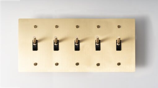 Five-Gang Satin Gold Brass Toggle Switch - Multiple-toggle switch featuring five controls in a durable satin gold brass finish, allowing extensive control over various connections.