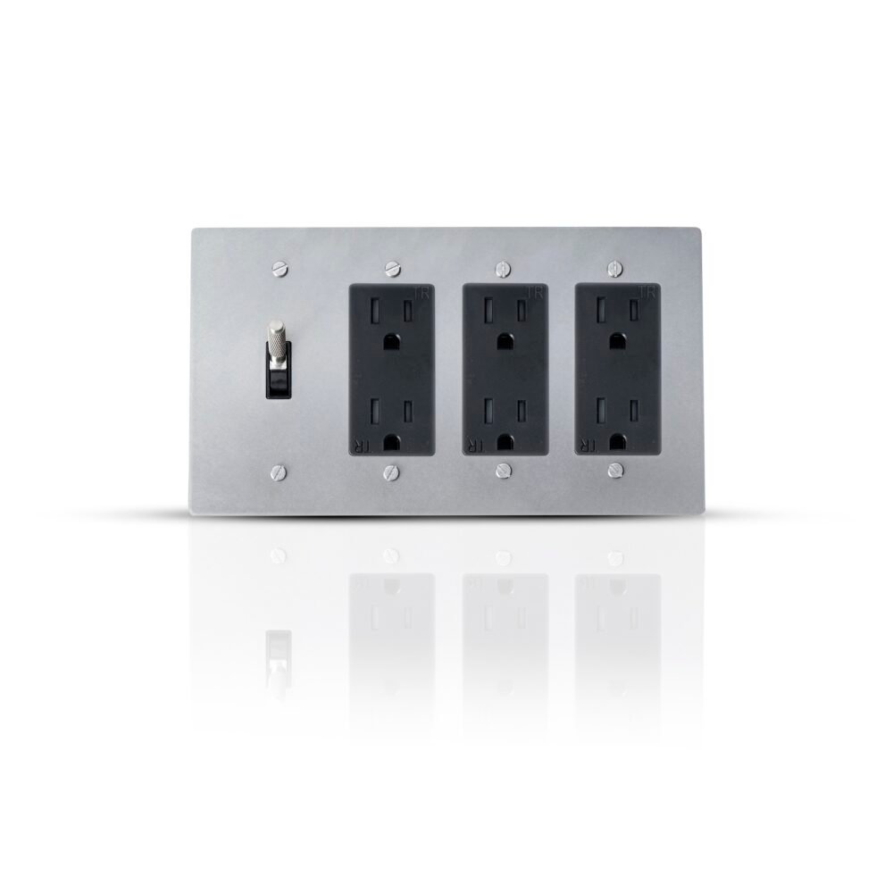 A sleek wall plate featuring a single toggle switch and three Decora style outlets, designed for a modern and efficient electrical setup in a stylish, contemporary interior.