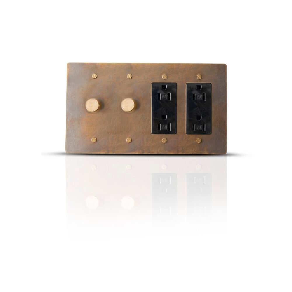 An elegant brass plate combining two dimmer controls and two Decora outlets, showcasing a blend of sophisticated design and functional versatility for modern electrical needs.